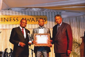 Andrew Chikomba receiving the MegaFest Award